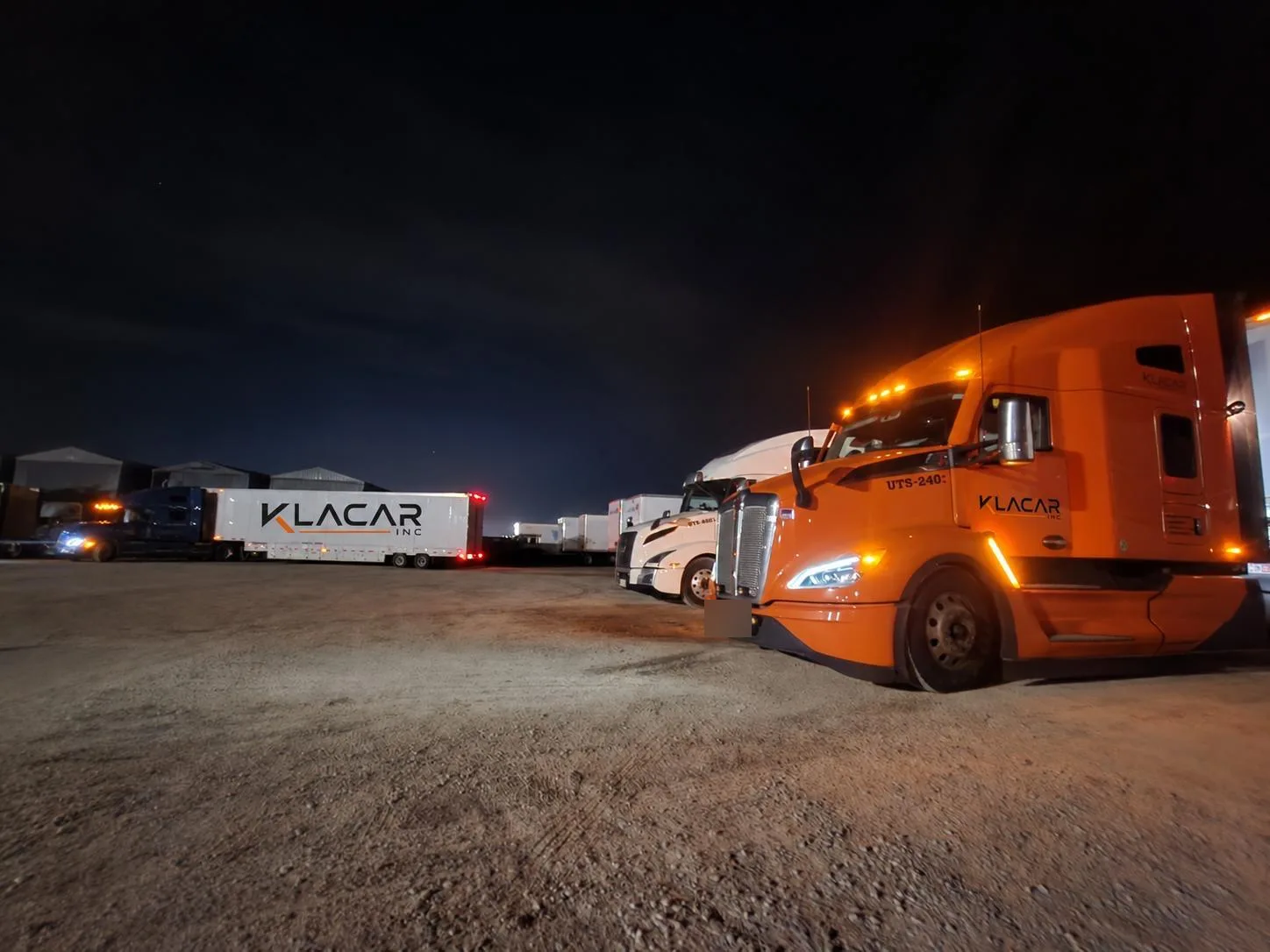 Klacar tractor parked at night