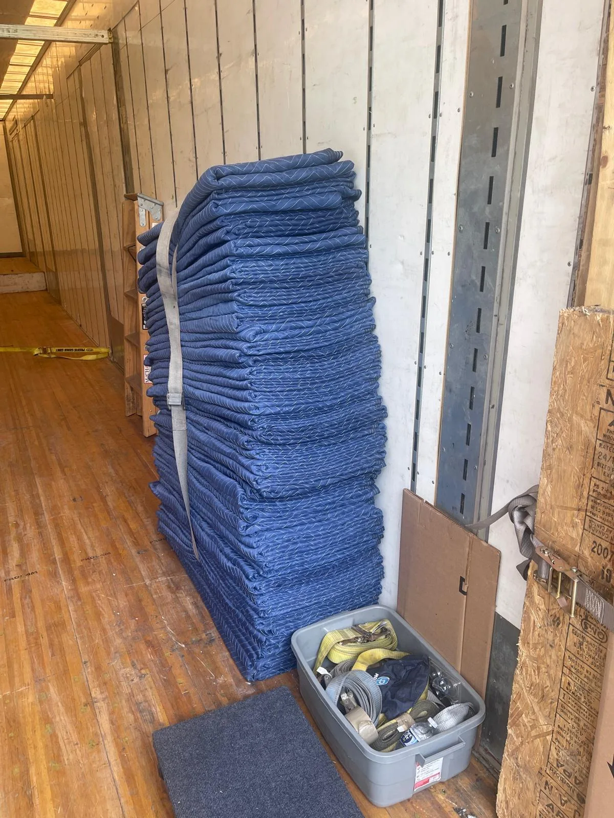 Stacks of moving blankets inside a Klacar truck